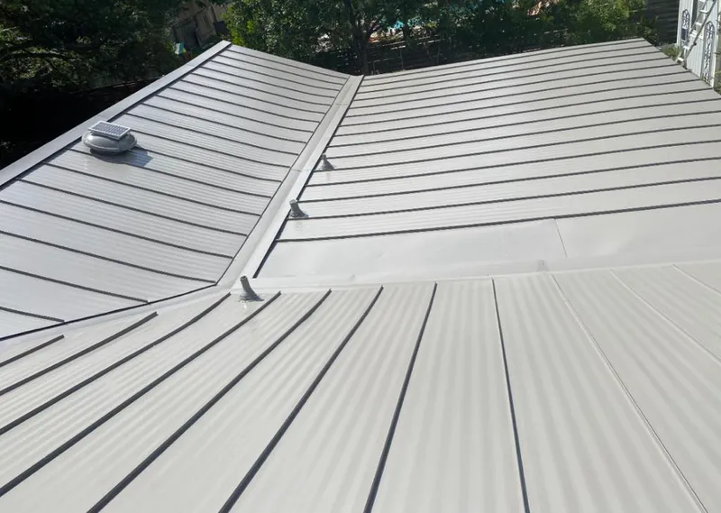 Solar attic fan installed on a metal roof for Roof Ventilation in Winter Park